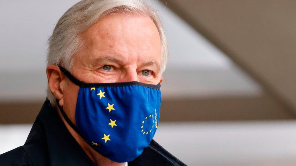 EU chief negotiator Michel Barnier, wearing a mask, walks to a conference centre to continue negotiations on a trade deal between the EU and the UK in London on November 9, 2020.