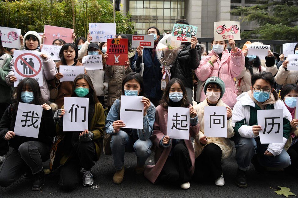 Supporters of Zhou Xiaoxuan display posters outside the Haidian District Peoples Court in Beijing on December 2, 2020