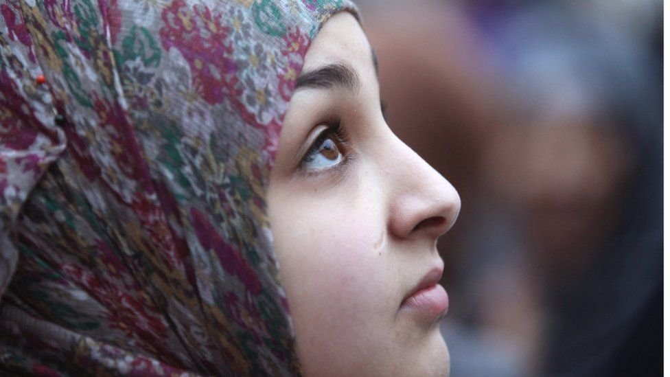 A young women wearing a headscarf