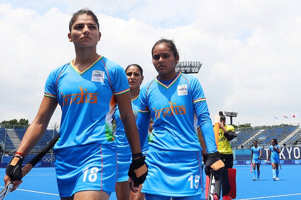 Udita, Nisha and members of Team India walk off the field after losing 4-1 the Women's Preliminary Pool A match between Great Britain and India on day five of the Tokyo 2020 Olympic Games at Oi Hockey Stadium on July 28, 2021 in Tokyo, Japan.