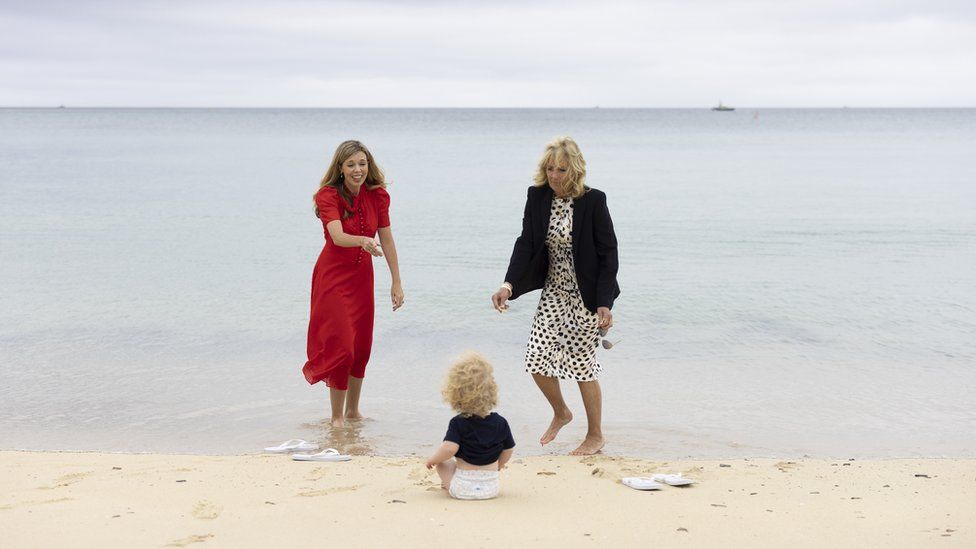 Carrie Johnson plays with her son Wilfred on the beach with Jill Biden
