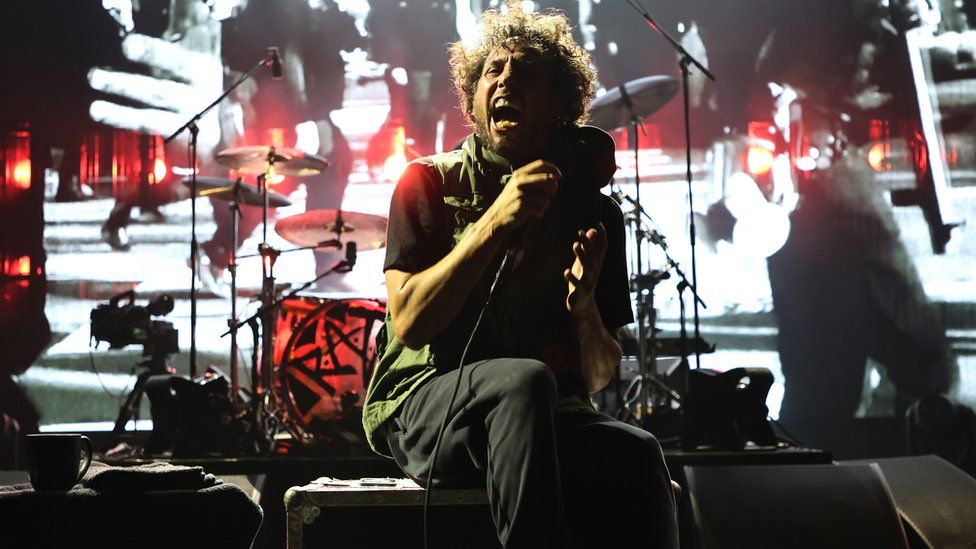 Zack de la Rocha performing seated at Madison Square Garden in New York on 8 August