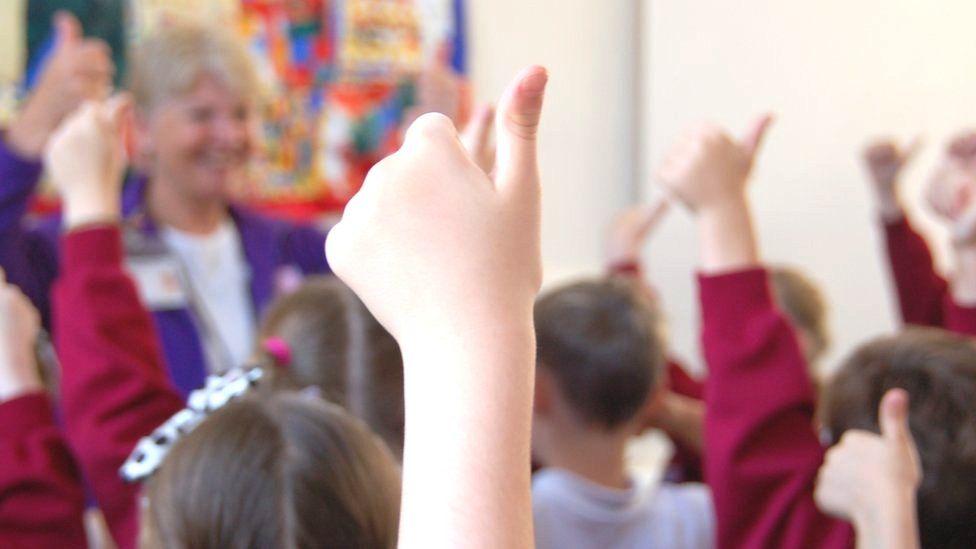 Close up children with hands up