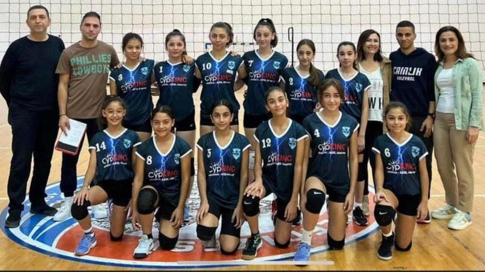 A female sports team from Famagusta Turkish Maarif College pose for a photo