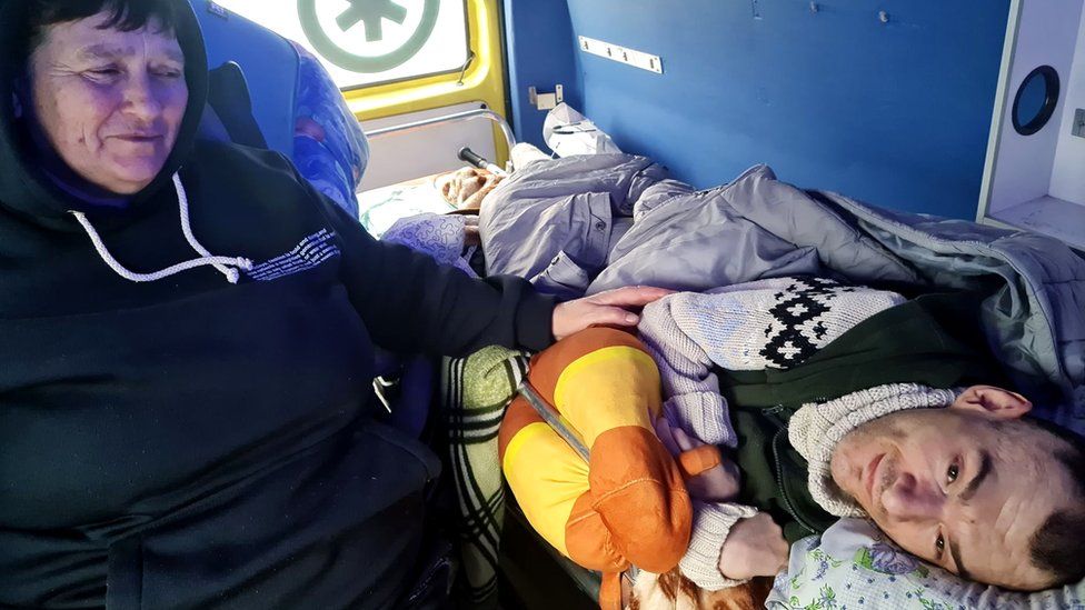 Olena Florek with her mother and brother in an ambulance as they travelled from Lviv to Krakow