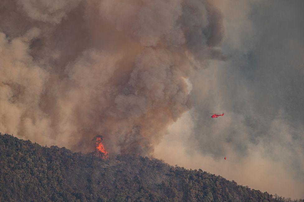 A water bomber helicopter is mobilized on a major forest fire near the town of Romeyer in south-east France.
