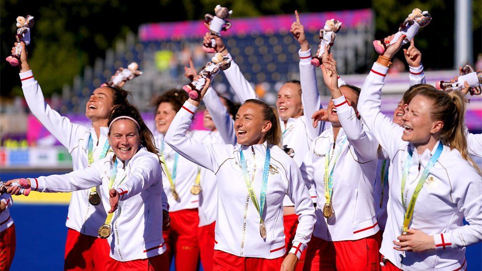 England's Hannah Martin (front, centre) celebrates with her team-mates after receiving their gold medals for the Women's Gold Medal Hockey match against Australia at the University of Birmingham Hockey and Squash Centre on day ten of the 2022 Commonwealth Games in Birmingham
