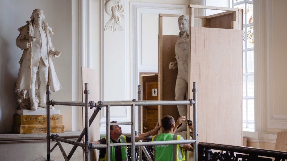 Statue of enslaver and Waterloo war hero Sir Thomas Picton is boxed up in preparation for its removal from Cardiff City Hall on July 24, 2020 in Cardiff
