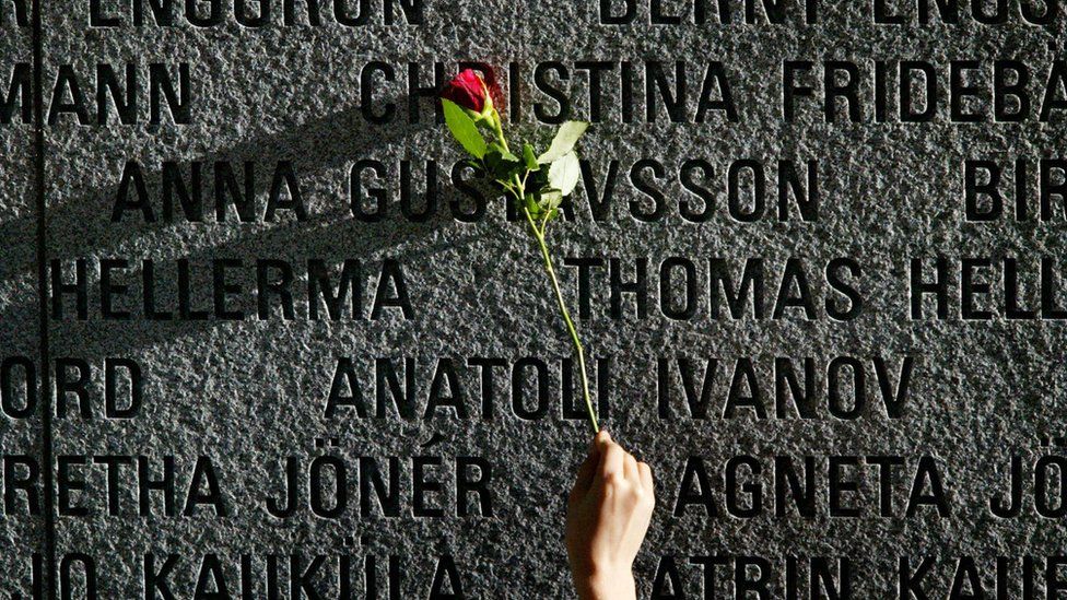 A flower is pictured on a granite wall bearing the names of the victims of the 1994 sinking of the "Estonia" car ferry in the Baltic Sea in 2004.