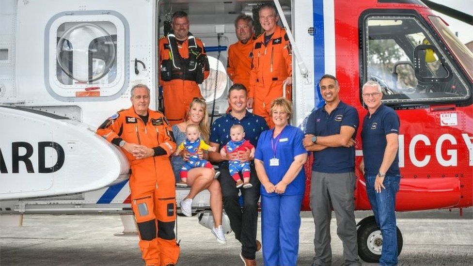 The family reunited with midwife Jane Parke and coastguard helicopter crew members who helped them