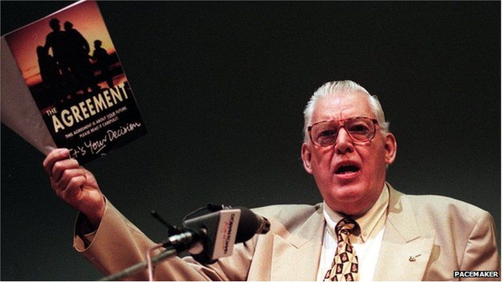 Ian Paisley holding a copy of the Good Friday Agreement Booklet