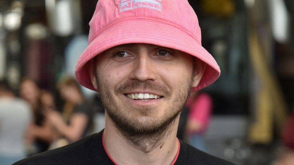 Oleh Psiuk, frontman of the 2022 Eurovision Song Contest winners Kalush Orchestra, smiles as he arrives at the Ukraine-Poland border crossing point near the village of Krakovets, in Lviv region, Ukraine May 16, 2022