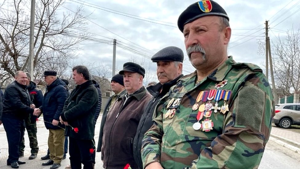 Vlad Untila attends a ceremony in the village of Molovata Noua