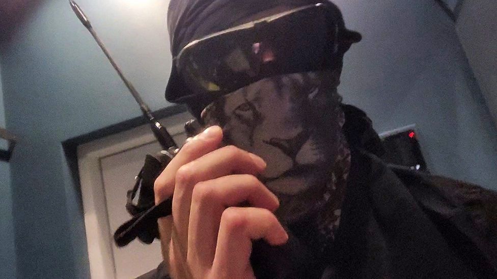 A member of the Squad 303/Anonymous hacker group