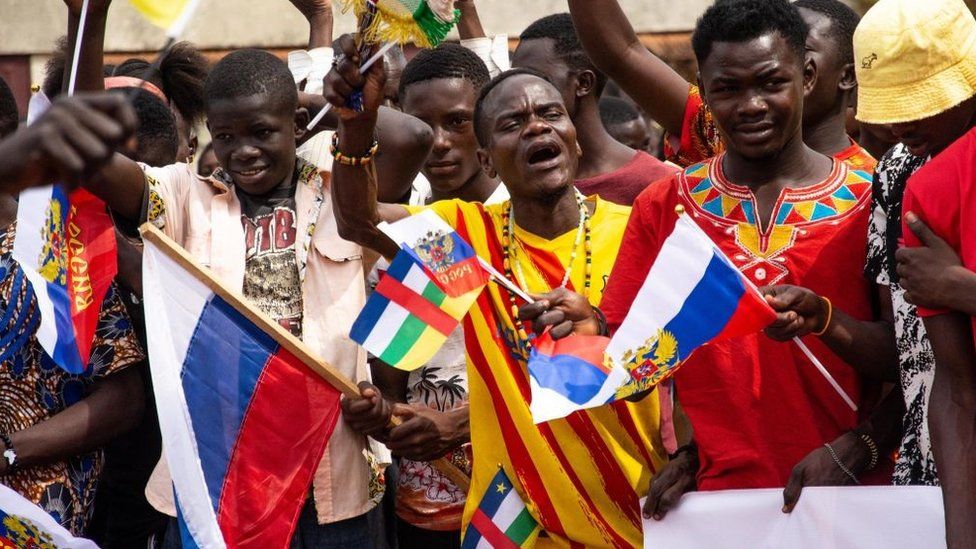 Russian and Central African Republic flags are waived by demonstrators gathered in Bangui on March 5, 2022 during a rally in support of Russia