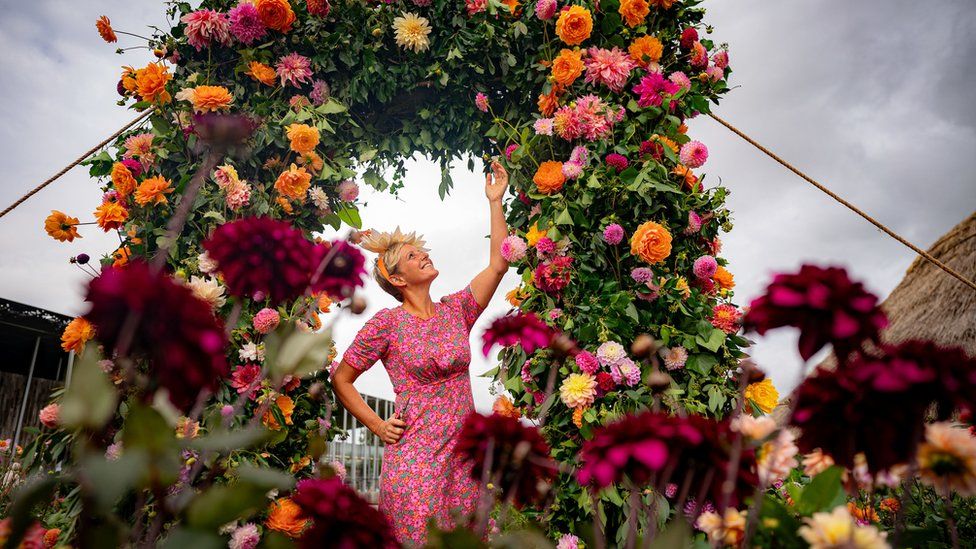 Andie McDowell in a flower arrangement