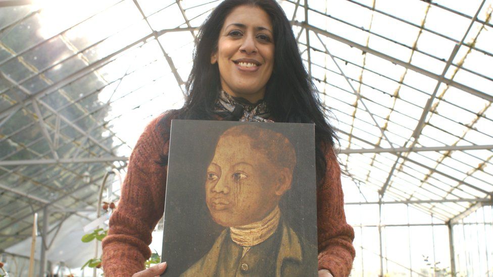 Zehra Zaidi hold portrait of John Ystumllyn at Harkness rose nursery