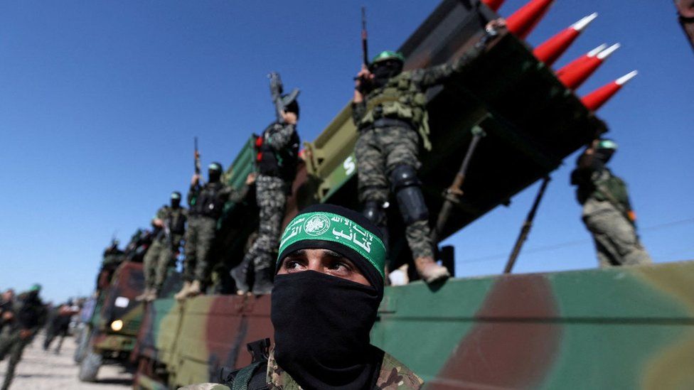 Hamas militants attend an anti-Israel rally in Khan Younis, in the southern Gaza Strip (27 May 2021)