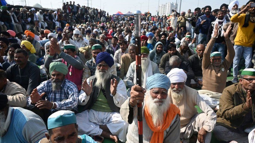 Farmers block a highway during a protest against agricultural reforms at the Delhi-Uttar Pradesh state border in Ghazipur on January 30, 2021