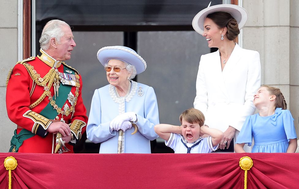 The Queen smiles on the balcony of Buckingham Palace during Trooping the Colour alongside the Prince of Wales, Prince Louis (front, centre), the Duchess of Cambridge and Princess Charlotte during Trooping The Colour on 2 June 2022 in London