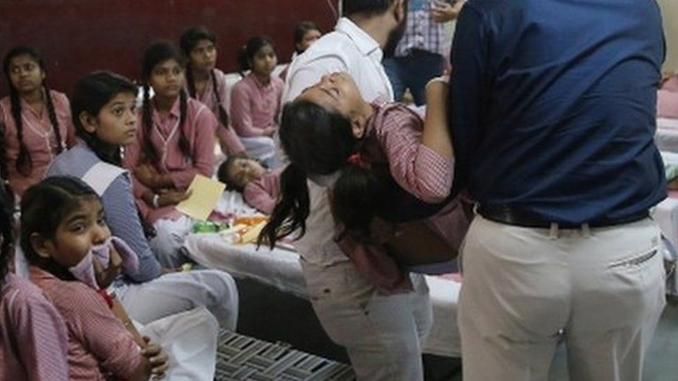 Indian schoolgirls receive medical treatment at a government hospital after gas leak in Tuglakabad, New Delhi on 6 May, 2017.