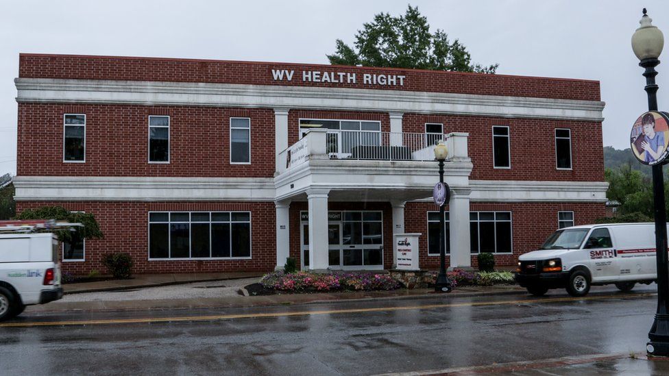 Exterior of WVHR building, red brick, white columns