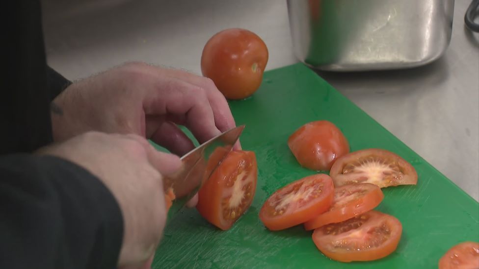 Tomatoes being chopped
