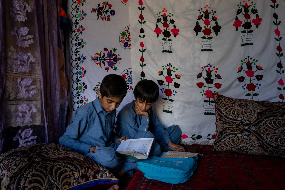 Imran and Bilal doing their homework together. They look out for one another, Abdul Azzi said. Image: Julian Busch/BBC