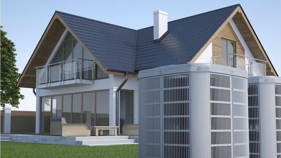 Air heat pump and house - stock photo