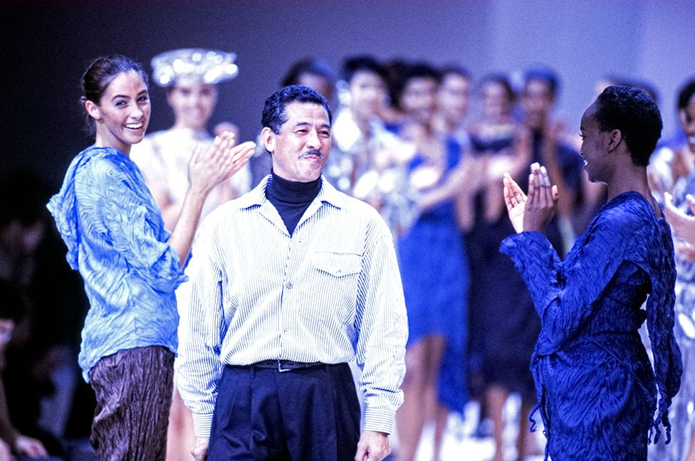 Issey Miyake and models during his Ready-to-Wear, Spring-Summer 1992 collection in Paris, France, in October 1991