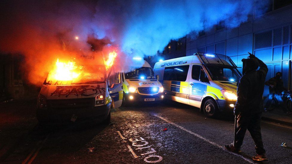 Burning police van
