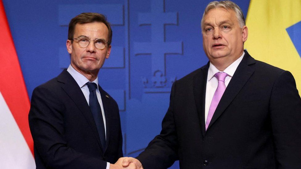 Swedish Prime Minister Ulf Kristersson and Hungarian Prime Minister Viktor Orban shake hands at a joint press conference in Budapest, Hungary, February 23, 2024