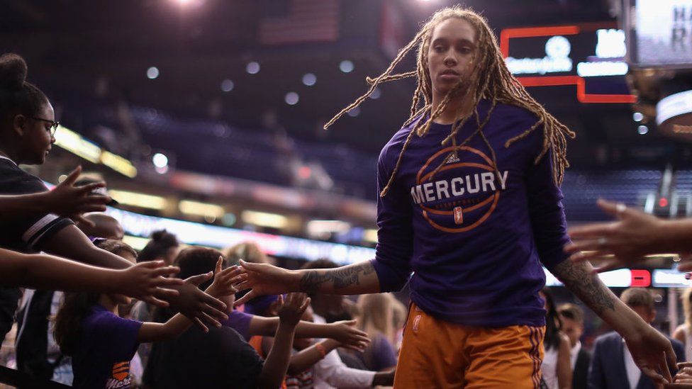 Brittney Griner #42 of the Phoenix Mercury high fives fans as she walks off the court following the first half of the WNBA game against the San Antonio Stars at Talking Stick Resort Arena on July 30, 2017 in Phoenix, Arizona