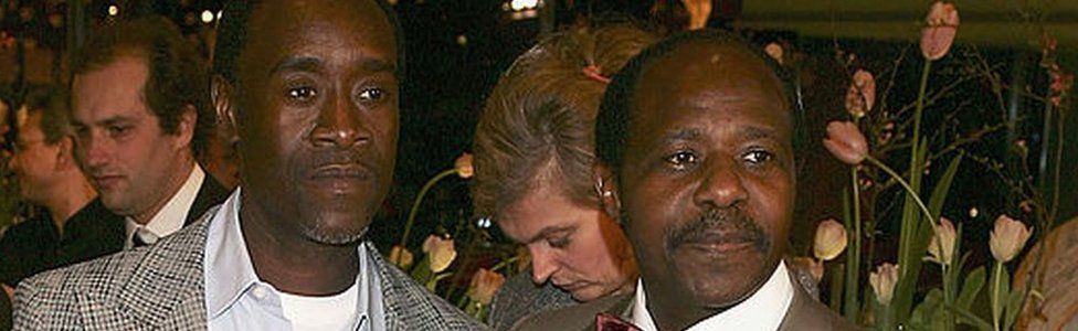 Actor Don Cheadle (L) and Paul Rusesabagina arrive at the "Hotel Rwanda" Premiere during the 55th annual Berlinale International Film Festival on February 11, 2005 in Berlin, Germany.