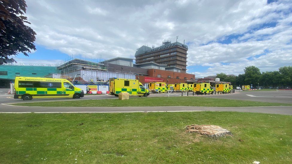Ambulances waiting to unload patients at Gloucestershire Royal Hospital
