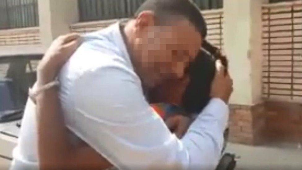 Still from video of Abdallah being reunited with Mostafa