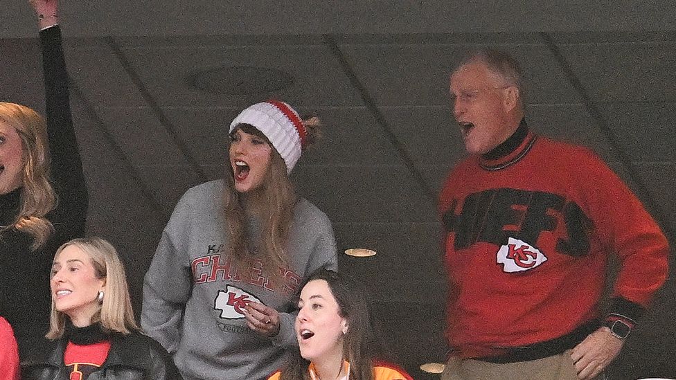 Taylor Swift, and Scott Swift cheer while watching the game between the Kansas City Chiefs and New England Patriots at Gillette Stadium on December 17, 2023 in Foxboro, Massachusetts.