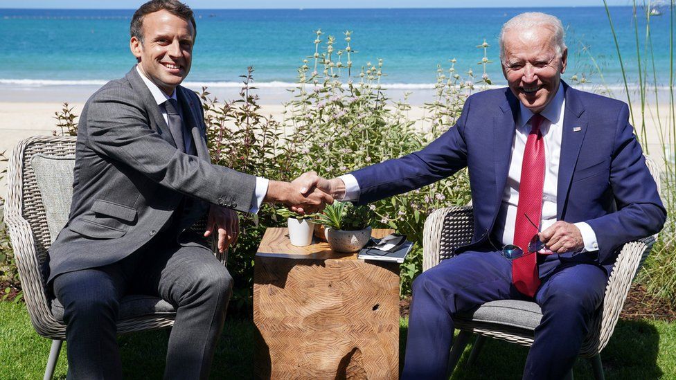 U.S. President Joe Biden and France"s President Emmanuel Macron shake hands as they attend a bilateral meeting during the G7 summit in Carbis Bay, Cornwall, Britain