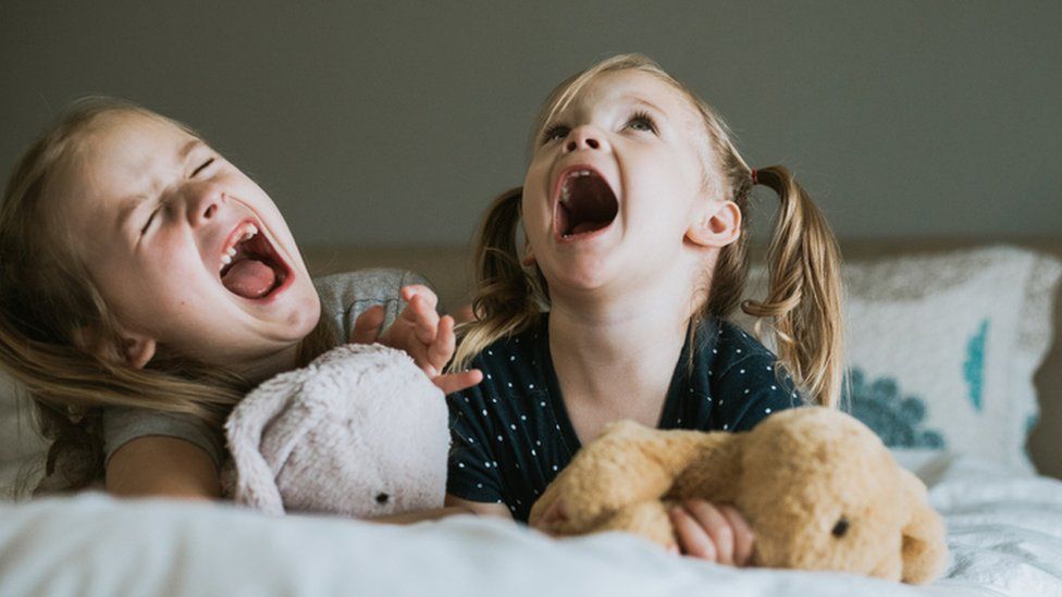 Two children laughing