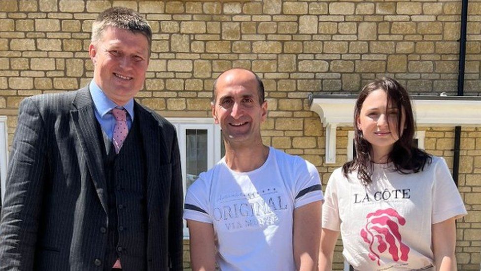 Yuksel and Alina with councillor Richard Clewer