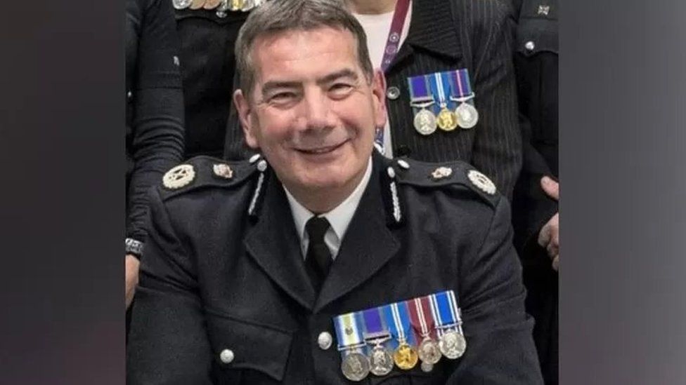 Man in police uniform wearing medals