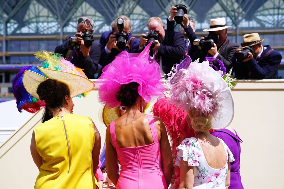 Racegoers have their picture taken during day three of Royal Ascot at Ascot Racecourse. Thursday June 16, 2022.