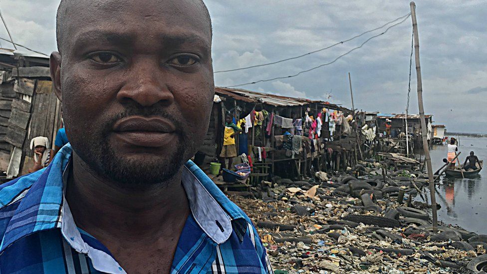 Seun pictured near his home in the slums of Lagos, Nigeria