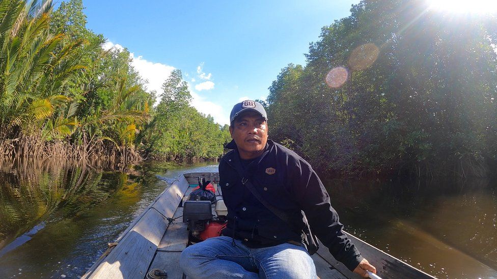 Suheri on a boat