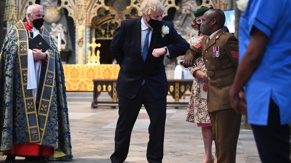 Boris Johnson greets Sgt Sebastian Mwaura from the Defence Medical Group at Westminster Abbey's annual service for the Florence Nightingale Foundation