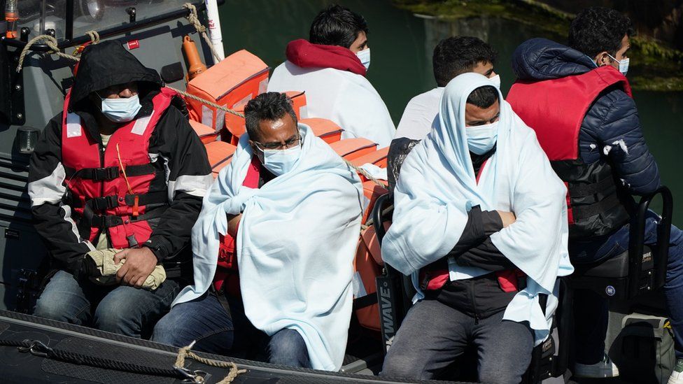 A group of people thought to be migrants are brought in to Dover, Kent, following a small boat incident in the Channel. Picture date: Thursday June 16, 2022.