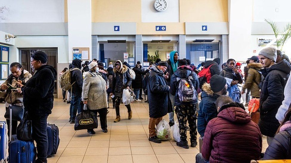 People queue at a border office in Hungary