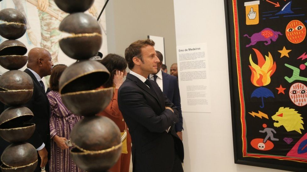 French President Emmanuel Macron attends the opening of a hybrid art exhibition in Cotonou, Benin, 27 June 2022, during the official visit of Macron to the Republic of Benin