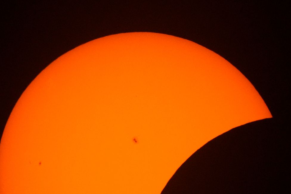 Sun spots are seen during the beginning phase of a total solar eclipse, Monday, April 8, 2024, in Arlington, Texas.