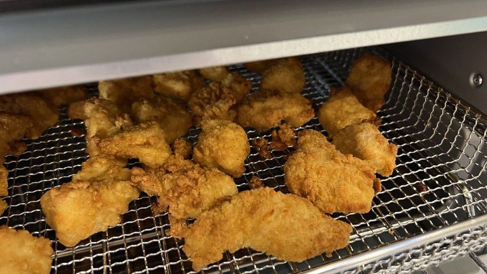 A basket of chicken nuggets, cooked in an air-fryer